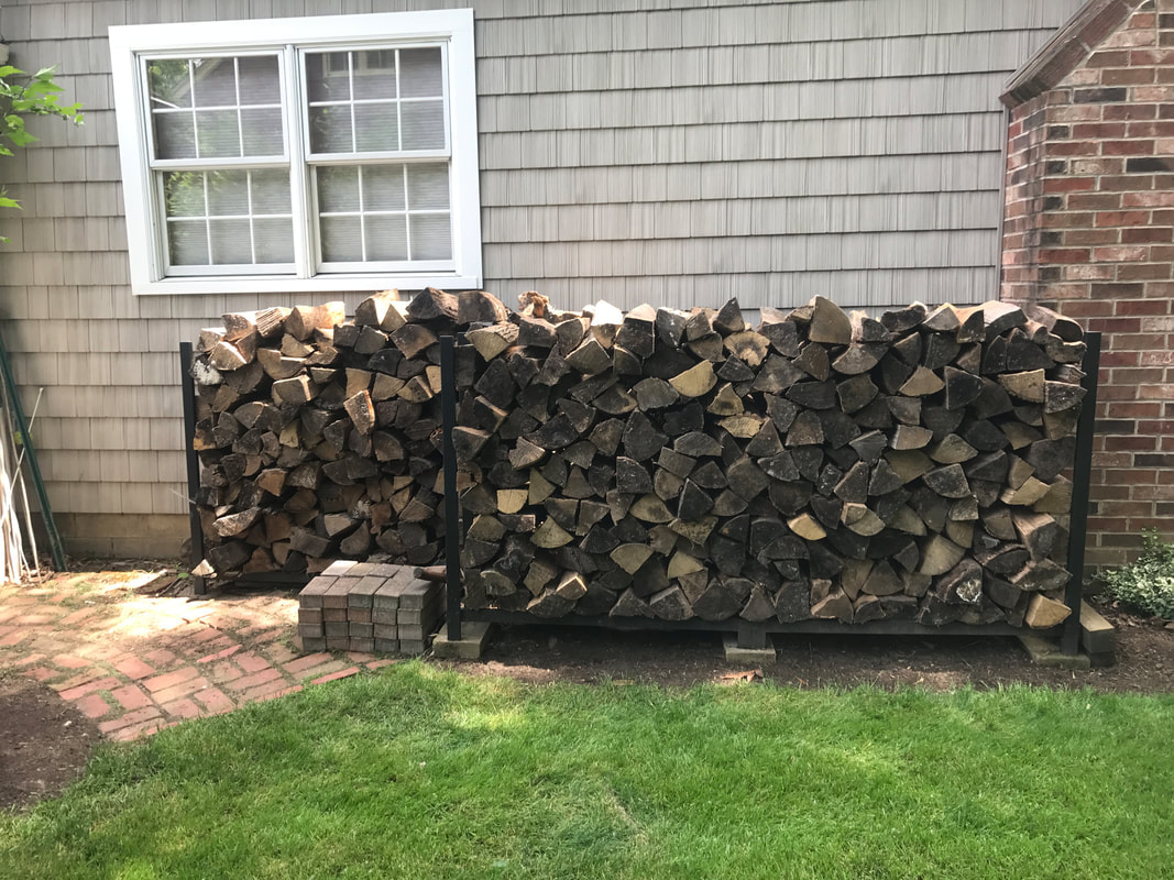 Neatly stacked firewood delivery
